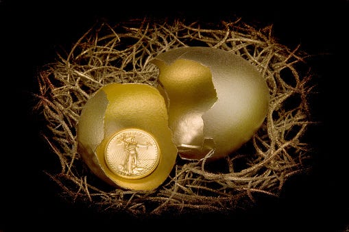 American Gold Eagle in a golden egg shell